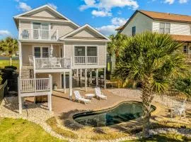 Waterway front home w/ private pool, fenced yard, boat dock, short walk to beach