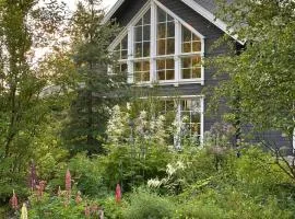 House With Prism Chandelier In Reisadalen