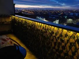 Panoramic top floor retreat with sky city views