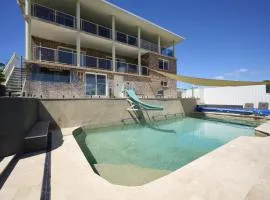 Family Coastal Retreat with Pool and Balcony Views
