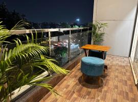 The Paras Studio Serviced Apartments, alojamiento con cocina en Gurgaon