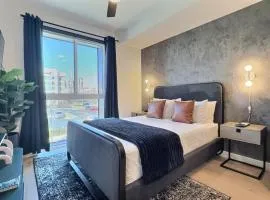 Smart Stay in Bham, Tesla Rides and Prime Location