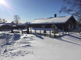 Holiday home in beautiful Rondane with pool and sauna โรงแรมในDovreskogen