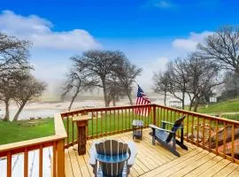 Idyllic waterfront getaway with private hot tub & deck views - near golf