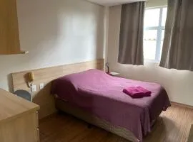 Flats da Júnia excelente localização, wi-fi, tv, ar, frigobar, garagem