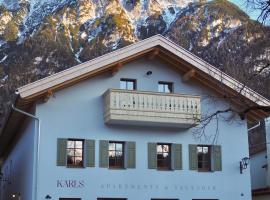 Karls Mittenwald - Design Apartments mit Alpenblick & Tagesbar im Herzen von Mittenwald, מלון במיטנוואלד