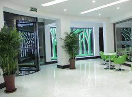 Vatica Tianjin Jinghai Bus Station Home World Plaza Hotel, готель у місті Jinghai