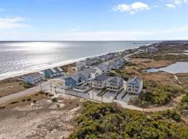 Stunning new build home with shared pool and private hot tub, close to beach