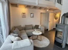 Villa Waterkant am See mit Sauna, Kamin & Garten