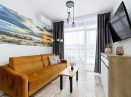Ku Morzu Nadmorski Apartament w Pobliżu Plaży z Basenem i Parkingiem by Noclegi Renters