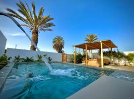 Relájate en piscina-spa, terraza BBQ y AC Paracas, Hotel in Paracas