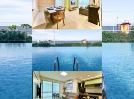 Apto 3 Quartos Condomínio Resort Completo Pé na areia com Piscina borda Infinita, Beach Tennis, Academia, Sala de Jogos, Brinquedoteca, Playground e Portaria 24H , Churrasqueira Privativa Reserve Agora e Viva essa Experiência, khách sạn ở Piçarras