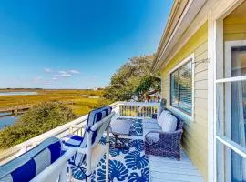 Light-filled coastal stay with open layout, water views, washer/dryer, and AC