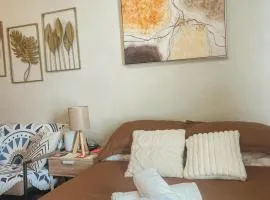 Gold-Themed Condo with Balcony and FREE Pool Access