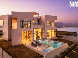 StayVista at Aria by the Hills with Pool, Lawn, Wi-Fi