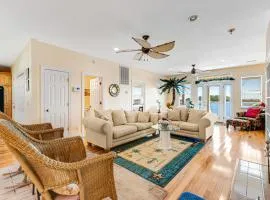 Waterfront charmer with expansive outdoor space, full kitchen, W/D, & central AC