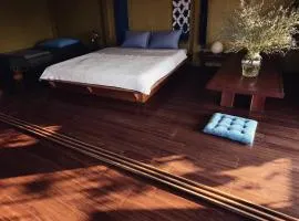 Here Library - A wooden home by the river with a library