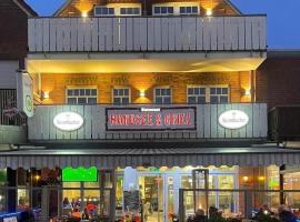 Ferienwohnung Nordseegrill, хотел в Боркум