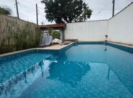 Casa Praia Grande 5min praia, 2 vagas, wi fi , 3 banheiros , piscina grande , freezer extra gelo , churrasqueira , até 9 pessoas