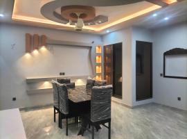 BM guest house in Bahria town Karachi, koča v mestu Karači