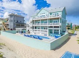 Lovely beachfront home with hot tub, pool, game room, & central AC