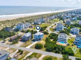 Grand beach home with elevator, private hot tub, game room, & pool access