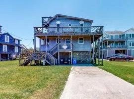 Dog-friendly home steps from beach with yard, multiple decks, and arcade game