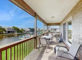 Dog-friendly, canal-front house with dock, balcony, deck, & central AC