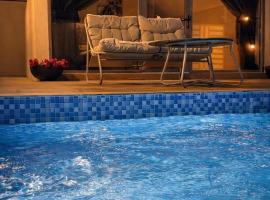 ستاي إن Stay Inn, hotel amb piscina a Nizwa