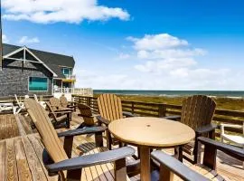 Three-story beachfront home with private pool, hot tub, decks, & ocean views