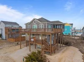 Enjoy a semi-oceanfront getaway, just two houses away from easy beach access!