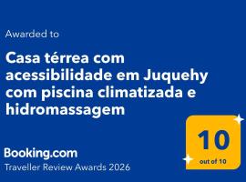 Casa térrea com acessibilidade em Juquehy com piscina climatizada e hidromassagem, hotel em Juqueí