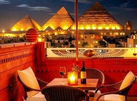 Mirage pyramids view hotel, hotel in Caïro