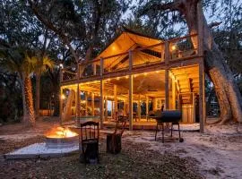 Unique Marshfront Treehouse Stay with Heated Soaking Tub & Adventure-Inspired Escape in Townsend, Georgia