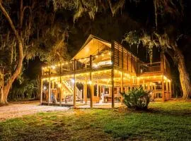 Marsh-View Treehouse Tent Glamping with Private Campsite, Wildlife Watching, BBQ, Fire Pit in Townsend, Georgia