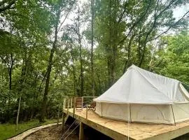 Enchanting Mountain Glamping Tents with Elevated Decks and Fire Pit Near Gentry, AR