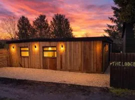 Cosy Canal-side lodge with log burner