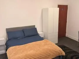 studio apartment with small kitchen and bathroom
