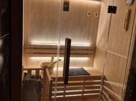 Appartement cosy de plein pied avec sauna, jardin et parking privé - proche gare et commerces