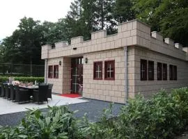 Designed home with bedstead surrounded by forest