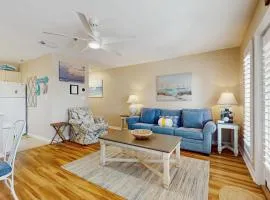 Bright open 3rd-floor condo with pool views from private balcony - next to beach