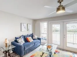 Updated condo with balcony central AC pools hot tub grills & beach access