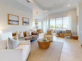 Lakefront condo with water-view balcony private golf cart resort pool & amenities