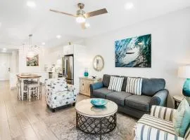 Newly built condo with WiFi shared pools hot tub & private beach access