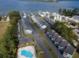 Calming water view condo with full kitchen balcony pool & TV - close to park