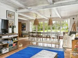 By The Bay A Thatched House Lies So Beautifully