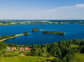 Mazurska Latarnia na prywatnej plaży tuż przy linii brzegowej pomost stawy gospodarstwo pasieka