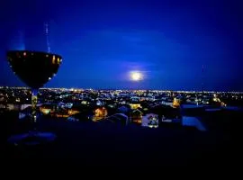 Panoramic top floor retreat with sky city views