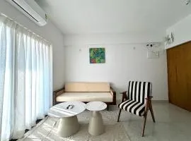 Boutique 1BHK Pool Retreat with Modern Amenities and Private Balcony