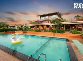 StayVista at Greenwich Meridian with Pool, River & Mountain View
